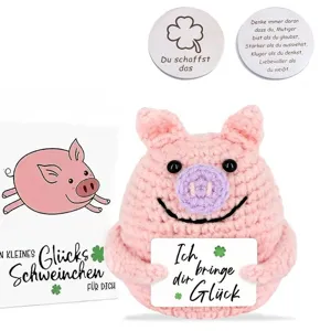 Hand-crocheted pink pig plush toy featuring motivational German cards for good luck