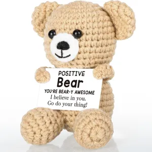 Handmade crochet emotional support bear plush toy holding positive message card desk decor.