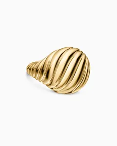 Macro detail view of a 18K gold-toned ribbed twisted ring with elegant polished finish.
