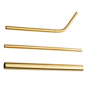 Detailed view of three golden reusable stainless steel straws on white background