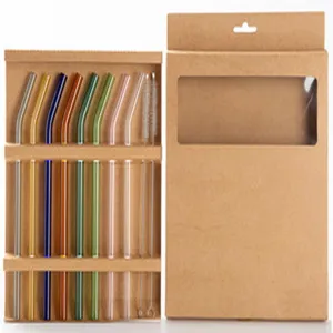 Macro view of colorful reusable glass straws set in brown cardboard packaging