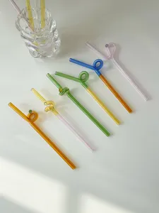 Colorful glass twist drinking straws and cute coffee stirring rods, reusable heat resistant designs.