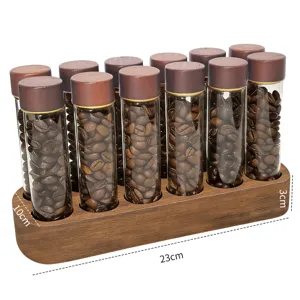 Detail view of 12-tube walnut coffee bean storage rack with glass tubes and wooden base.