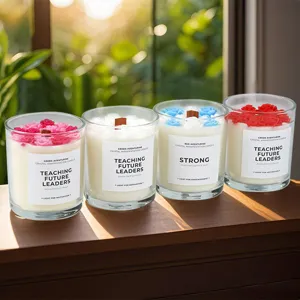 Soy wax scented candle in glass jar with wooden wick and flower design. Perfect cozy home decor.