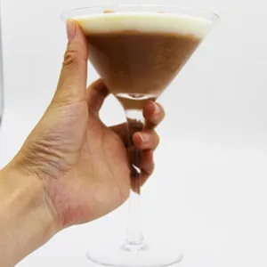 Close-up detail of the espresso martini scented candle in a glass, layered wax design.