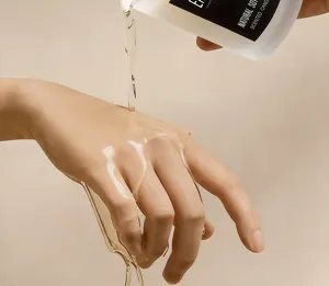 Detailed view of melting soy wax pouring on hand from a scented candle, premium home fragrance.