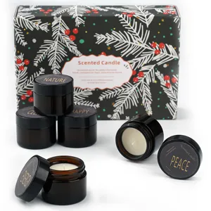 Detailed view of gift scented candles in amber jars with gift box, perfect aromatic decor.