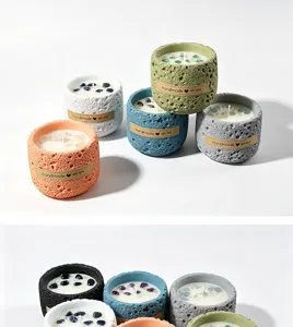Handcrafted scented candle in textured planet cup with crystal stones, various colors available.