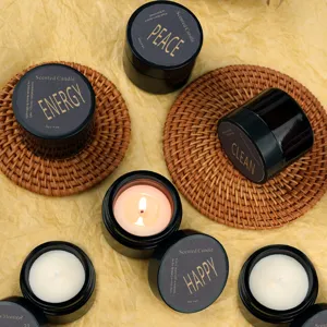 Scented soy wax candles in black jars with wooden coasters for gift, home decor and relaxation.