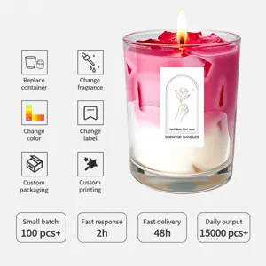 Scented soy wax candle in glass jar with pink gradient wax and rose petals for home decor.