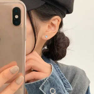 Minimalist heart moonstone stud earrings for women in daily lifestyle setting view.