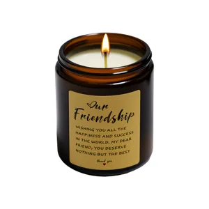 Scented candle in amber glass jar with friendship gift label, relaxing home decor fragrance.