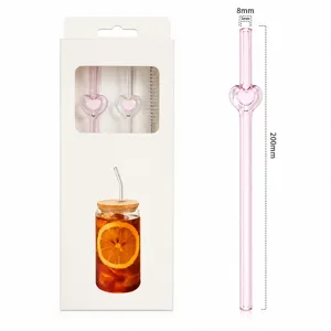 Close-up view of the pink glass straw featuring a cute heart design with size details.