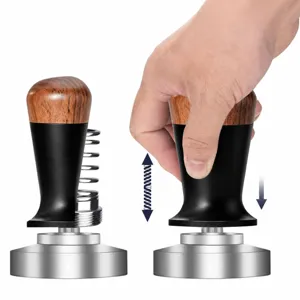 Stainless steel espresso coffee tamper detail showing internal constant force spring and grip.