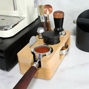 Detail shot of wooden espresso tamper holder station set with distributor and tools for coffee bar.