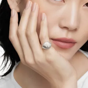 Elegant minimalist silver pleated twist ring with a stylish textured finish for women