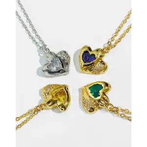Detailed view of heart-shaped zircon necklaces in gold and silver plating options