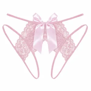 Close-up detail of pink lace crotchless thong featuring a large satin bow and delicate straps.