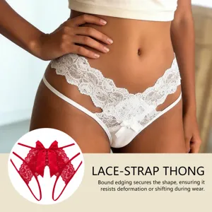 Detailed view of the lace strap thong featuring delicate floral lace and cute bow accent.