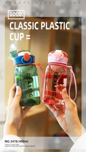 Detail view of portable plastic sports water bottle with hand strap and fruit infuser filter.