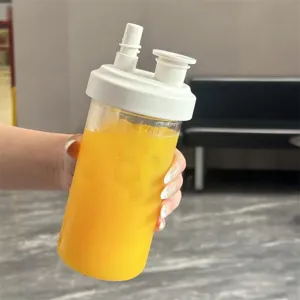 Detailed view of a portable plastic straw cup filled with refreshing iced orange juice