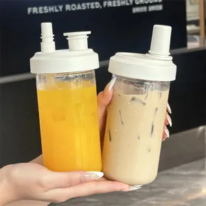 Reusable plastic straw cup set for bubble tea and juice, presented held in hand for scale