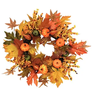 Vibrant autumn harvest wreath featuring mini pumpkins, berries and maple leaves detail