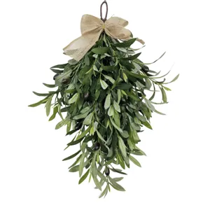 Macro view of detailed artificial olive teardrop wreath with a rustic burlap bow decoration