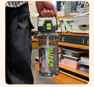 2L large capacity sports water bottle with straw held in a lifestyle setting