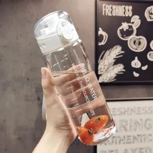 Portable plastic sport water bottle with pop-up lid, scale marks, and large capacity design.