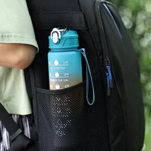 Macro view of a 750ml frosted gradient sport water bottle in a backpack side pocket.