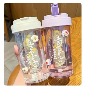 Close-up detail of cute portable plastic straw cups featuring internal filters and lemon slices