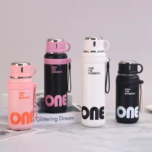 Four stylish 316 stainless steel vacuum insulated water bottles in pink white and black