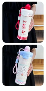 Cute cartoon 316 stainless steel straw thermos cup with portable strap for outdoor daily use.