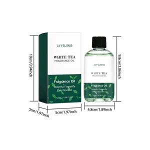 Vue détaillée de la bouteille d'huile parfumée au thé blanc et de sa boîte avec dimensions.
