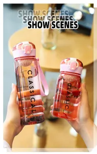 Pink transparent plastic water sports cup with strap and scale markings for daily use outdoor.
