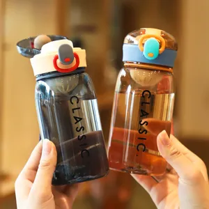 Portable plastic water bottle with pop-up lid and strap, perfect for outdoor sports and student use.