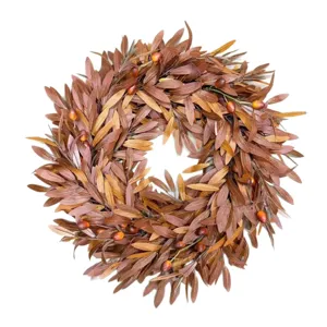 Detailed view of autumn wreath with brown leaves and berries for harvest decor