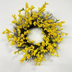 Detailed view of a vibrant yellow forsythia wreath with natural brown twigs.
