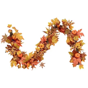 Close-up of artificial fall maple leaf garland with mini pumpkins and yellow berries.