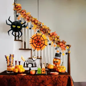 Decorative autumn garland with maple leaves and pumpkins draped on an indoor staircase