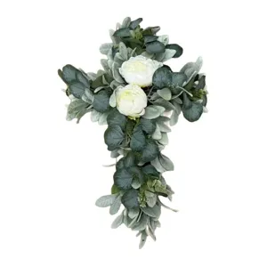 Elegant simulated floral cross wreath with white roses and eucalyptus for door decor