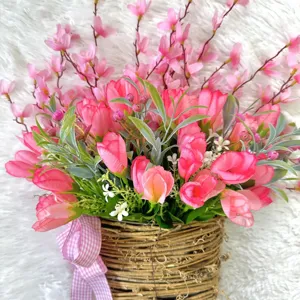 Detailed close-up of artificial pink tulip flower basket for farmhouse door decor.