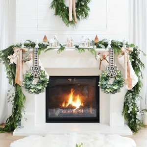 Realistic artificial eucalyptus wreaths with buffalo plaid bows on a white fireplace