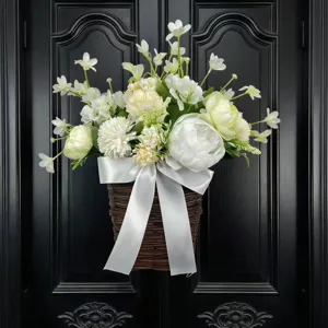 Detailed view of an elegant artificial white peony and narcissus floral door basket