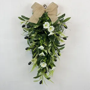 Detailed view of olive teardrop wreath with white morning glories and burlap bow