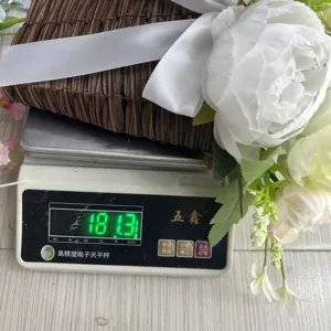 Weight measurement detail showing 181.3g for this elegant artificial peony flower basket