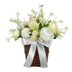 Artificial peony and narcissus flower arrangement in a wicker basket for door decor.