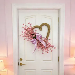 Decorative heart-shaped artificial spring jasmine wreath displayed on a white paneled door