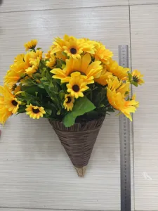 Detailed view of artificial sunflowers in cone hanging basket with ruler for scale